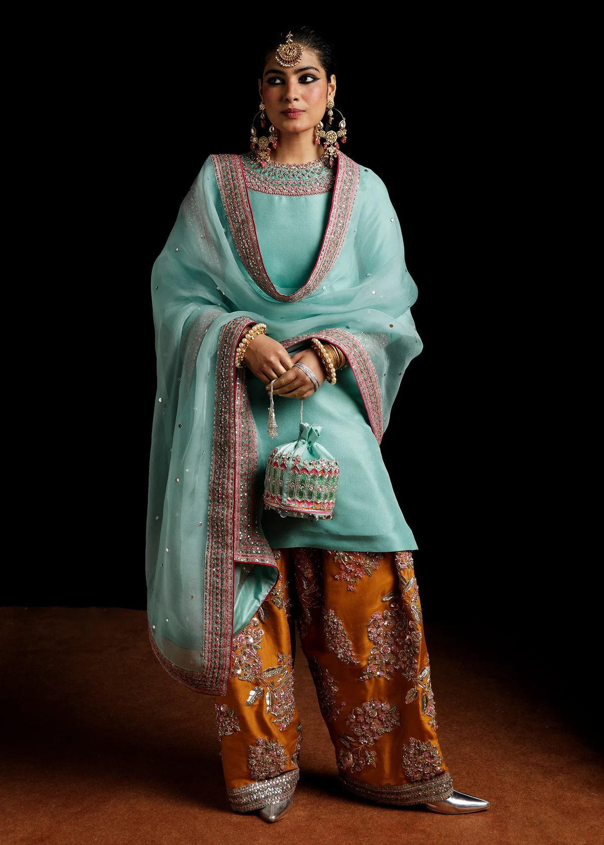 Maya ice blue raw silk shirt with mustard shalwar by Hussain Rehar, full length front view