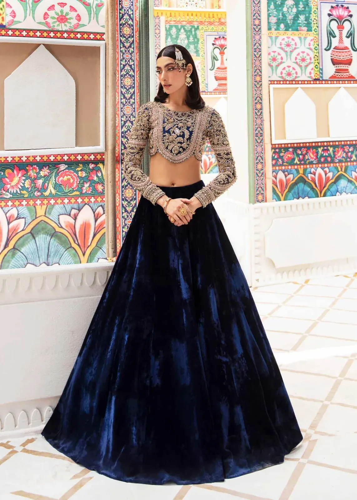 Nandini royal blue velvet lehenga with heavily embellished organza choli, full-length front view