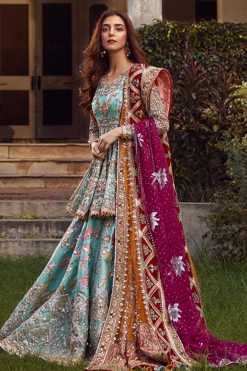 Full-length view of Ronaq Jahan sky-blue bridal lehenga choli with mustard and plum dupattas